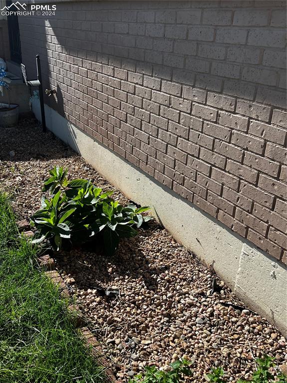 Image 21 of 23: Flower beds in front of home