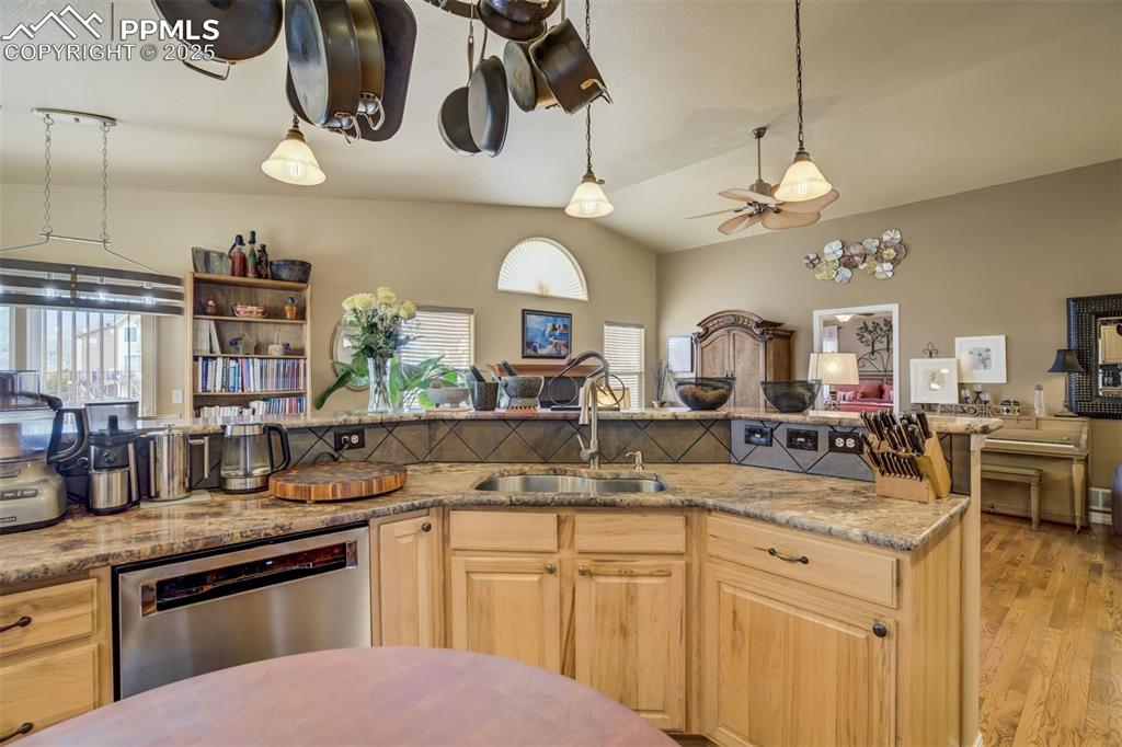 Image 10 of 50: Another view of the Kitchen showing the Stainless Steel sink, countertop sp