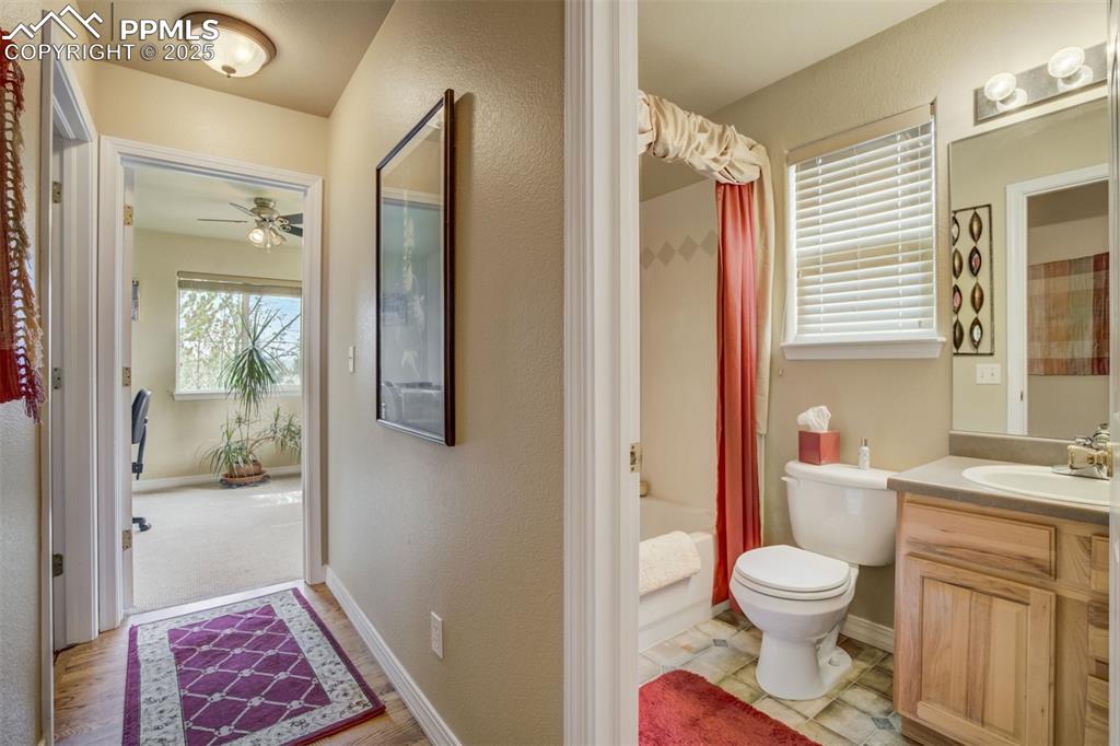 Image 24 of 50: Main floor, 2nd bathroom with vanity, bath/shower combination.