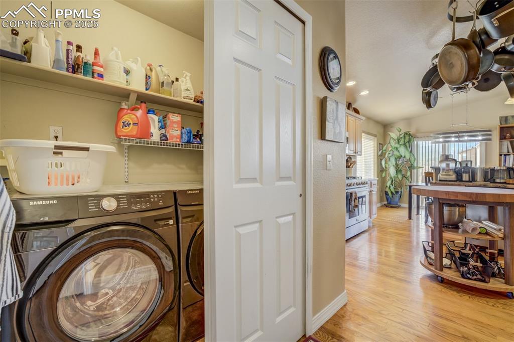 Image 25 of 50: Convenient Main floor laundry closet with shelving. Washer and Dryer Excl