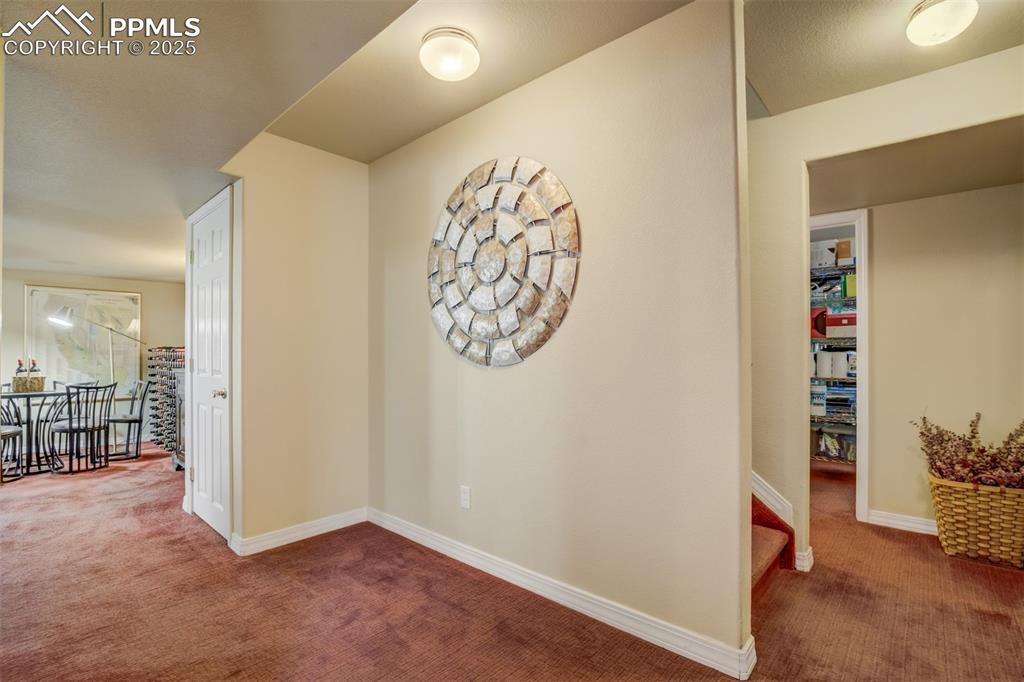 Image 27 of 50: Basement foyer area leading to the Family Room and Bedrooms.