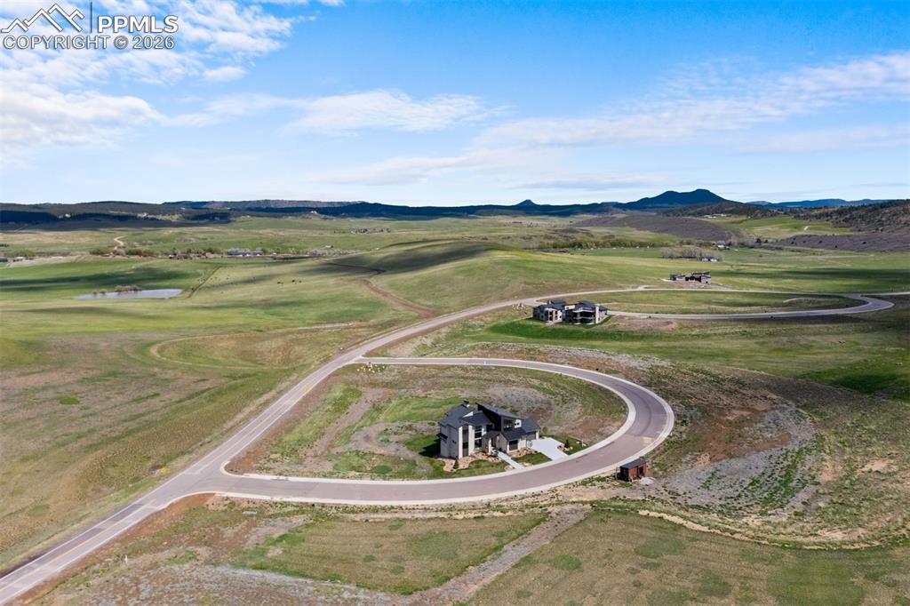 Image 37 of 37: Aerial perspective highlighting the home’s expansive setting and surroundin