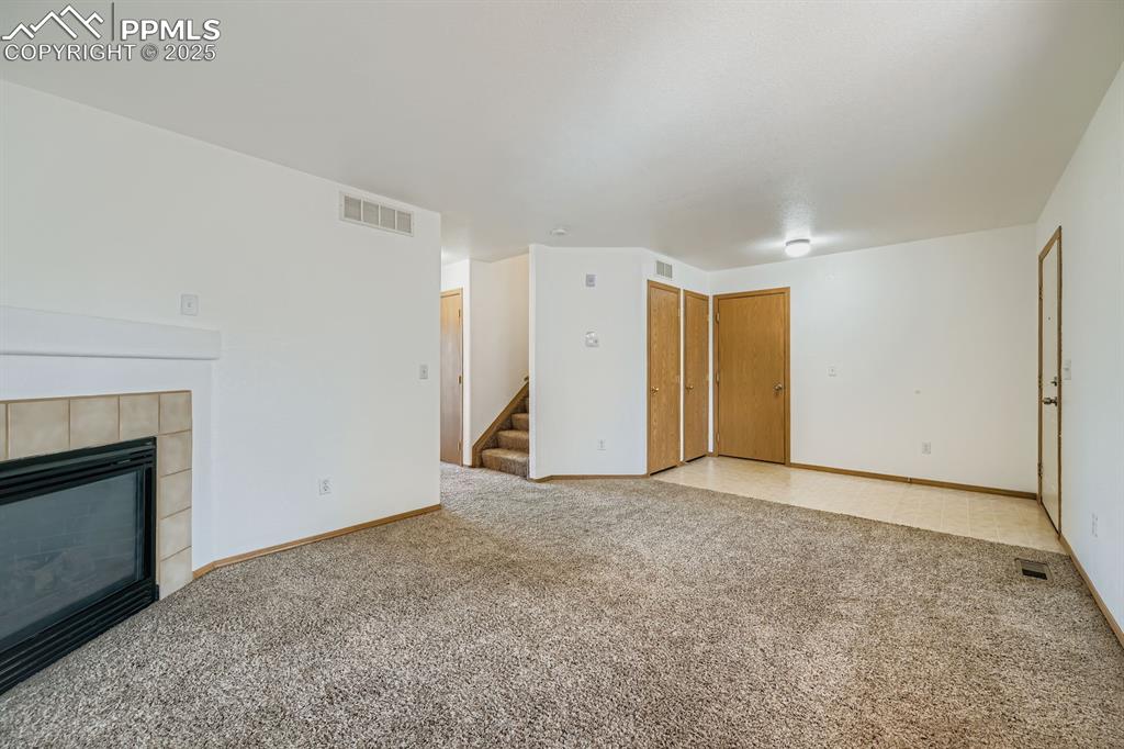 Image 7 of 43: second view living room, room for the big screen TV