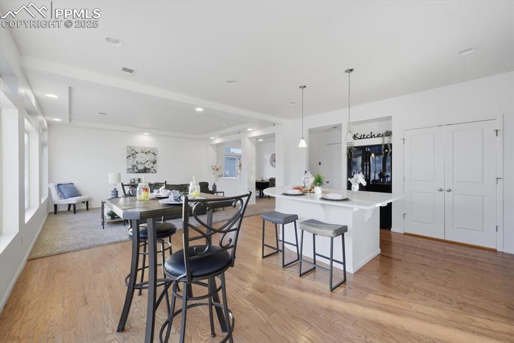 Image 19 of 41: Dining area featuring light wood-style floors and recessed lighting