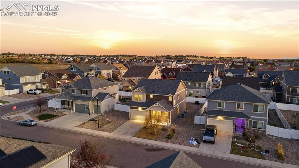 Image 2 of 41: Aerial view at dusk of a residential view