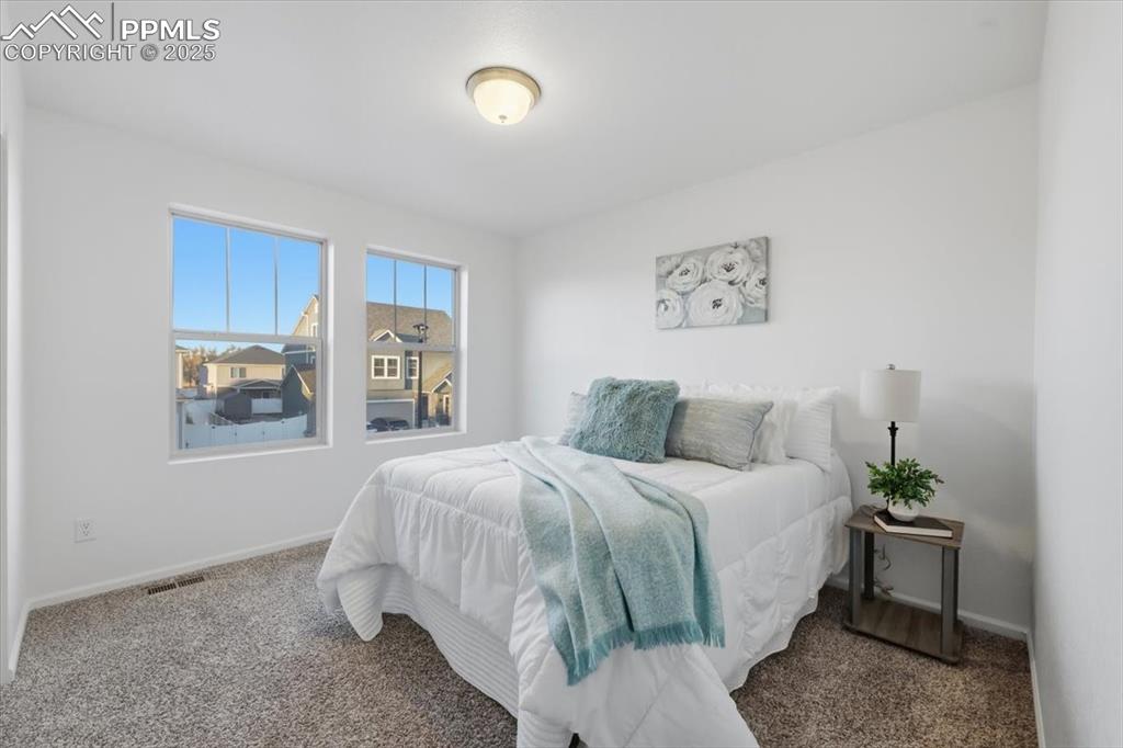 Image 28 of 41: Carpeted bedroom with baseboards