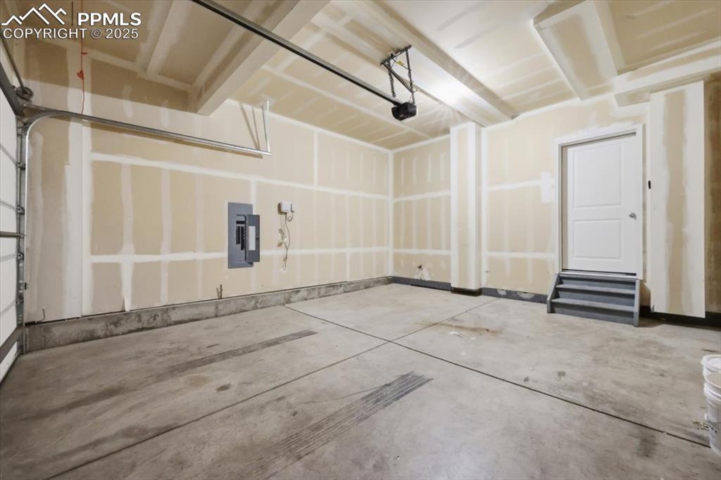 Image 37 of 41: Garage featuring electric panel