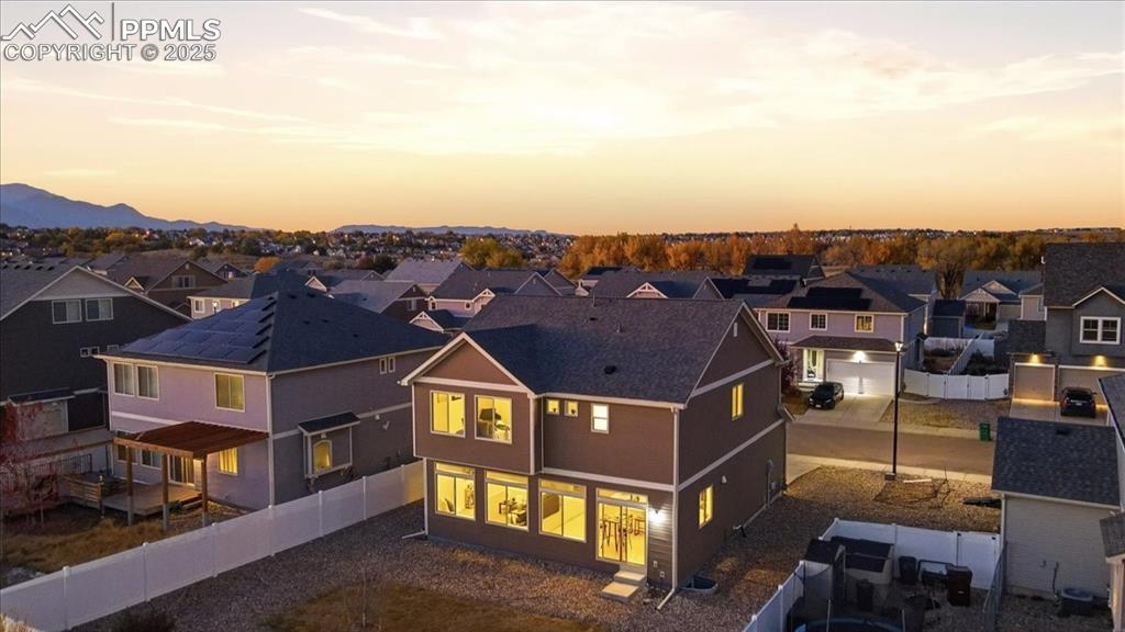 Image 4 of 41: Aerial view at dusk of a residential view