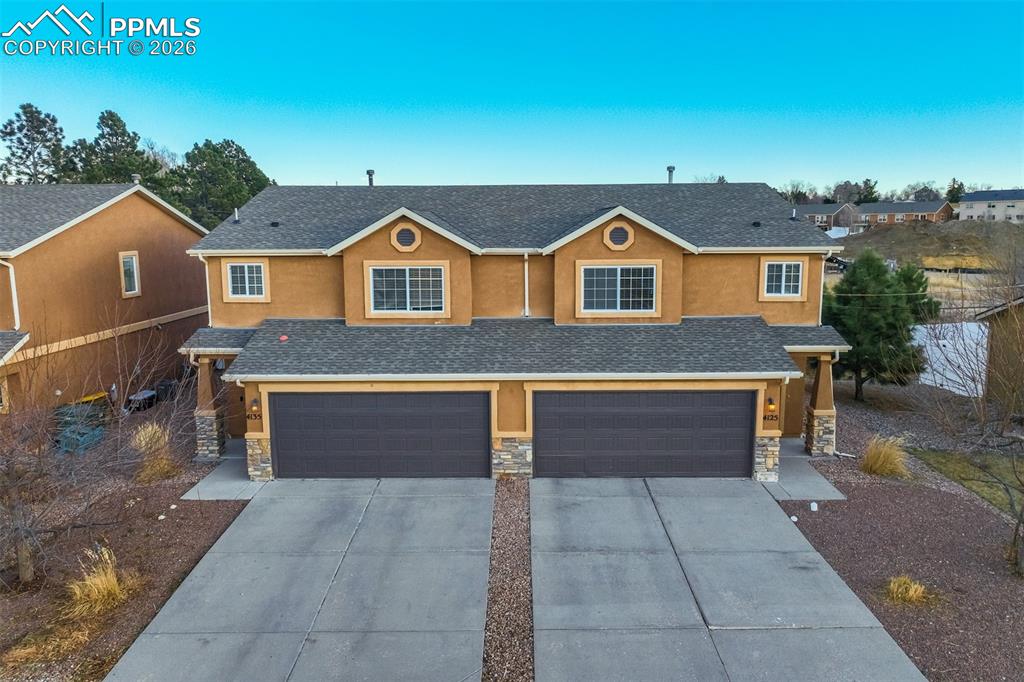 Image 1 of 50: Attractive multi-level exterior with well-maintained landscaping and a welc