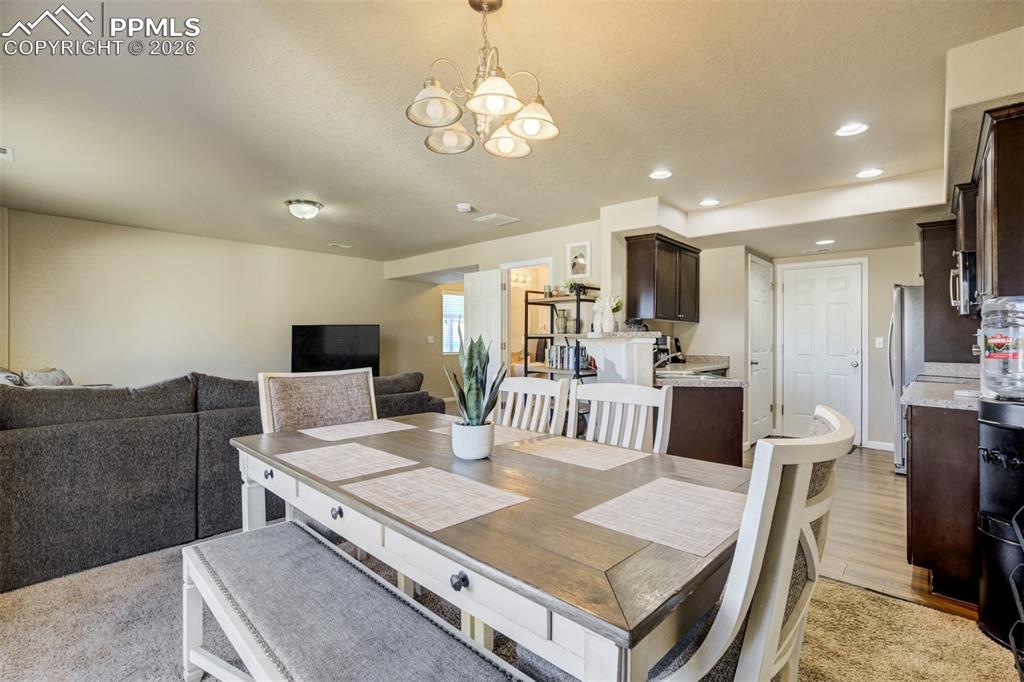 Image 13 of 50: Open-concept kitchen and dining space designed for functionality and connec