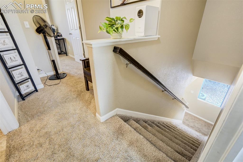 Image 20 of 50: Open upper-level landing with convenient access to bedrooms and added space