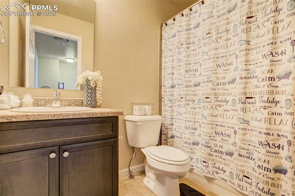 Image 32 of 50: Well-appointed full bathroom featuring a spacious vanity, ample counter spa