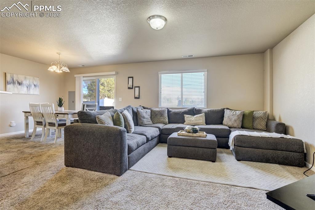 Image 7 of 50: Bright and inviting living space with neutral tones, generous seating area,