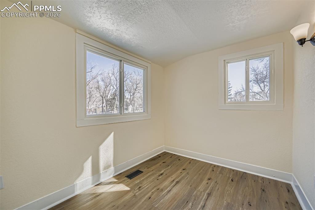 Image 24 of 34: Second bedroom or home office