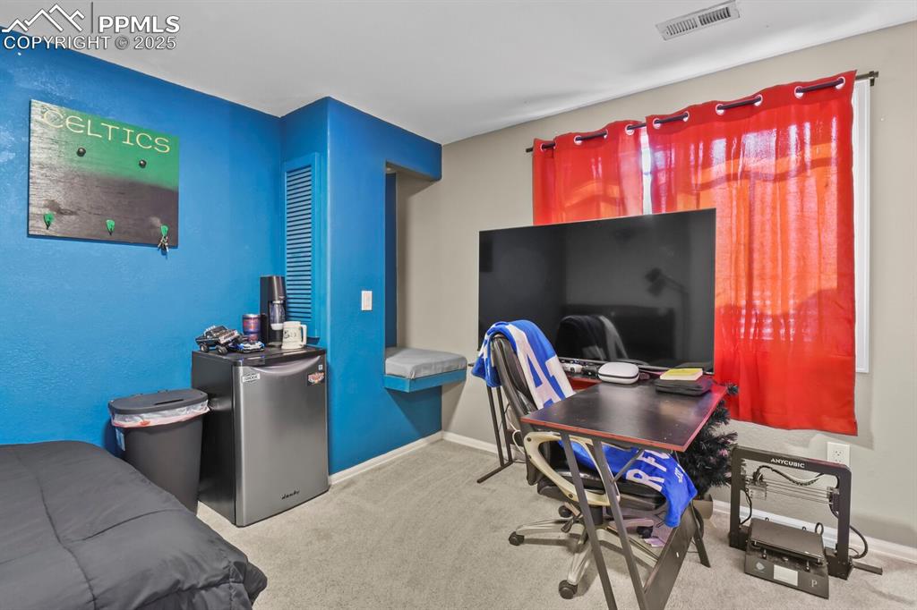 Image 33 of 50: Office space featuring carpet flooring and baseboards