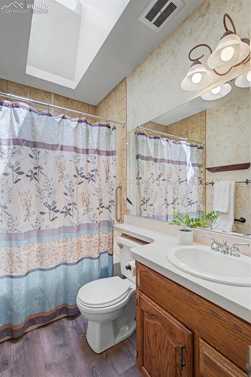 Image 18 of 46: Upstairs Bathroom with skylight
