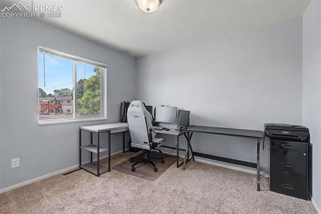 Image 19 of 46: Upstairs Bedroom #2 being used as an office