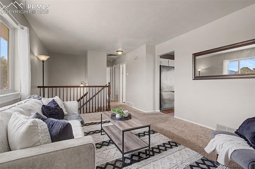 Image 9 of 46: Upper level with 2 bedrooms and living space
