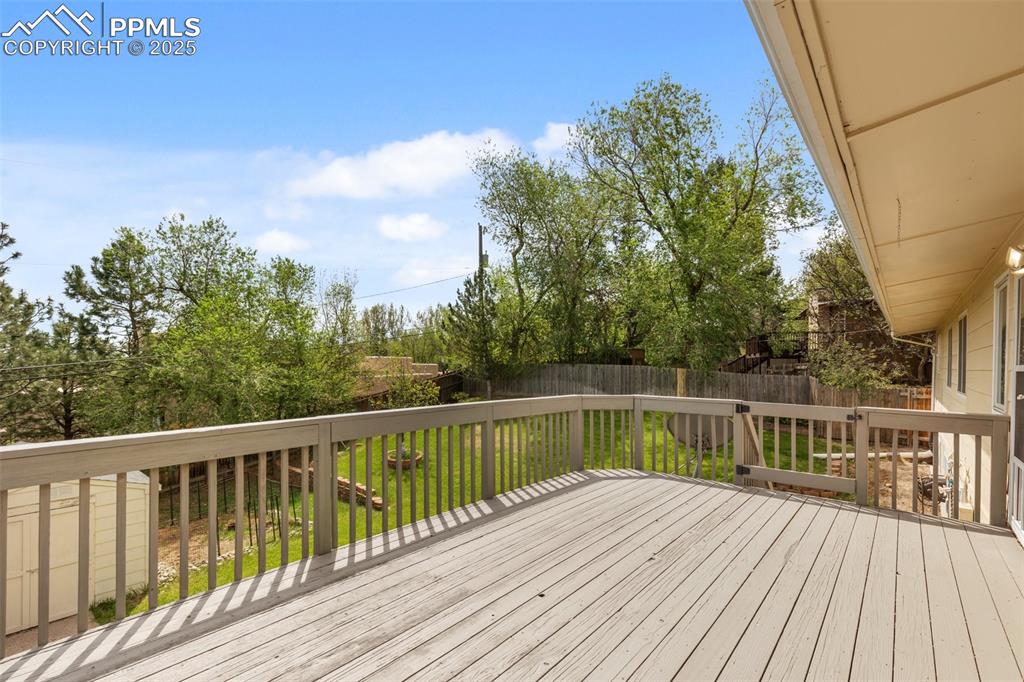 Image 8 of 50: Back deck overlooking the yard