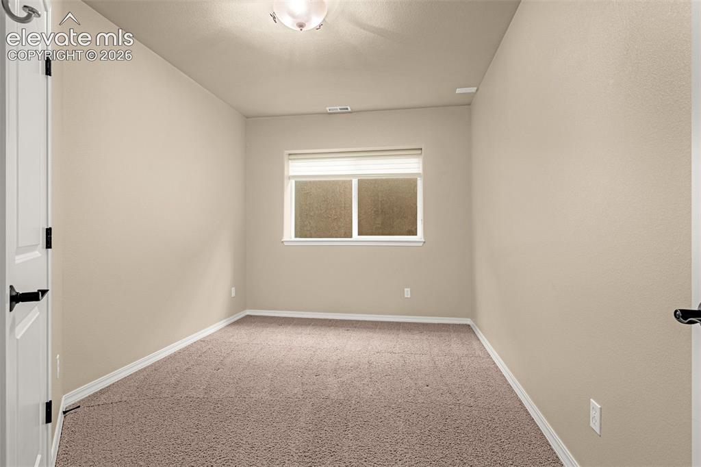 Image 31 of 46: Bedroom #3 in basement