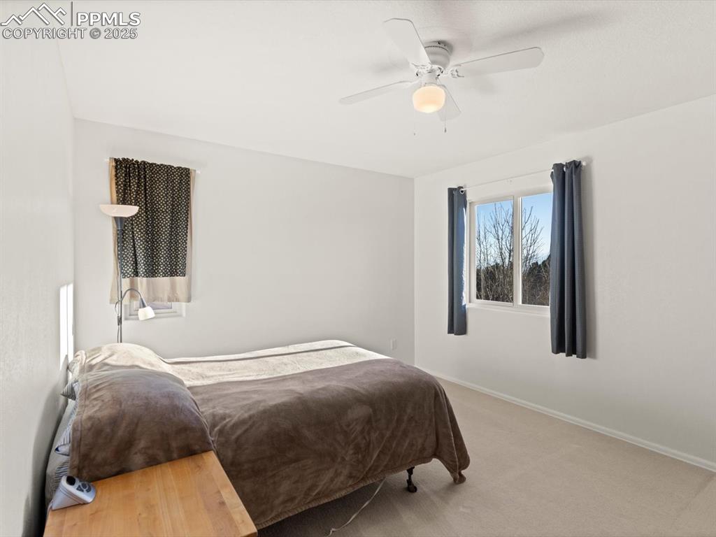 Image 29 of 49: Bedroom featuring carpet floors and ceiling fan