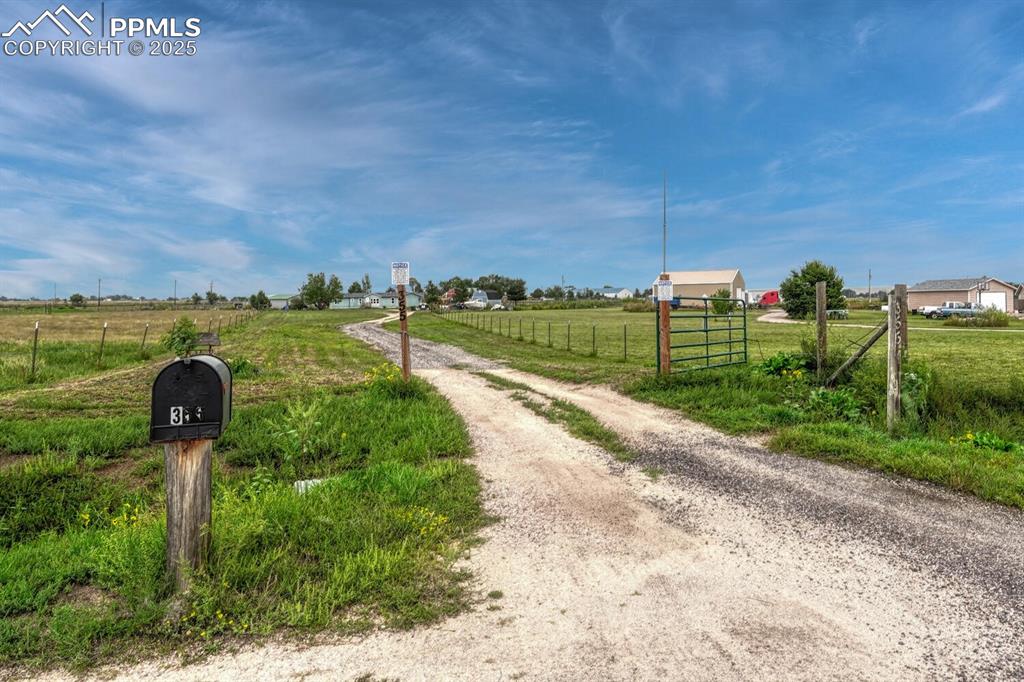 Image 2 of 38: View of dirt / gravel road featuring a view of rural / pastoral area and a 