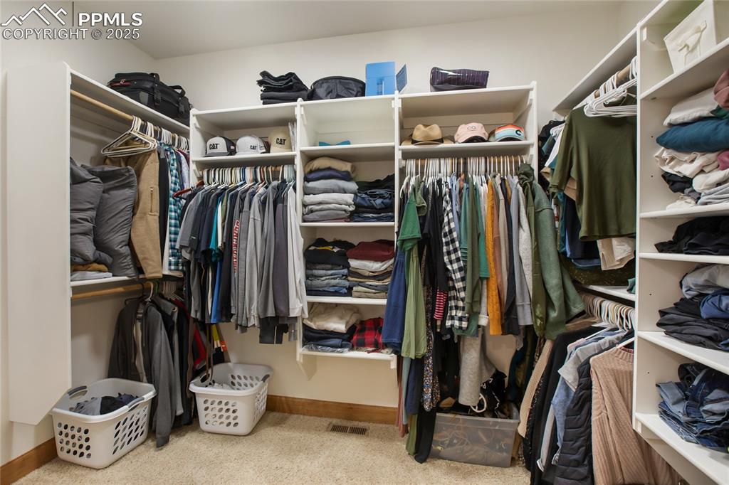 Image 25 of 49: Primary walk in closet on main level