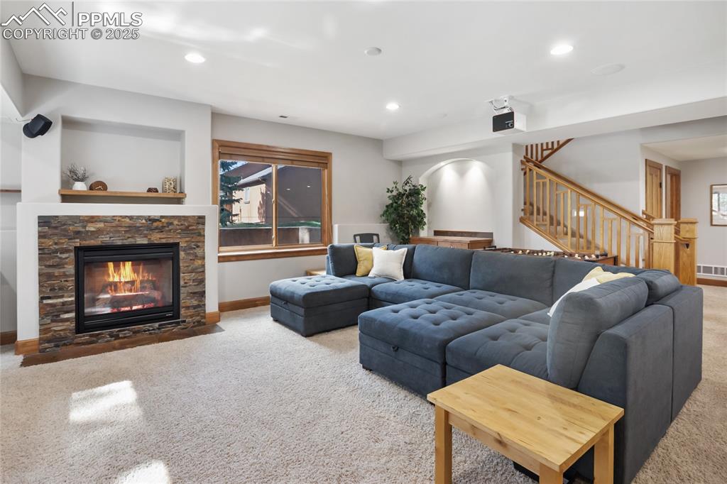 Image 33 of 49: Family room with gas fireplace