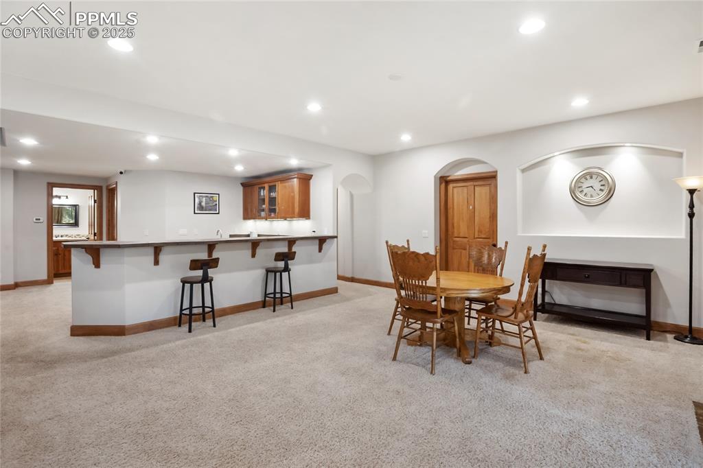 Image 35 of 49: Open concept with wet bar