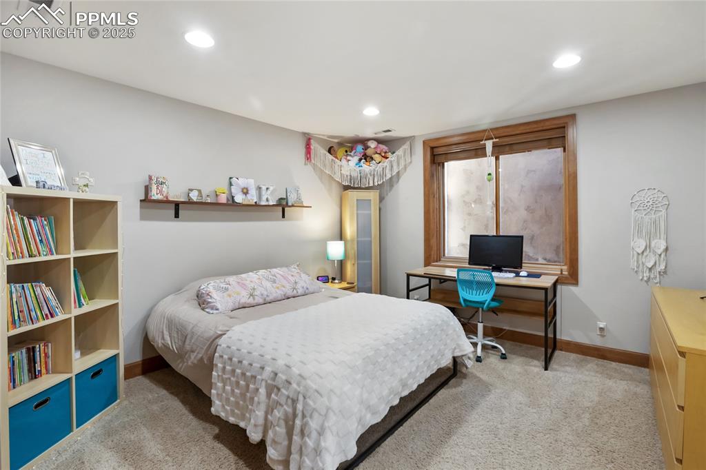 Image 39 of 49: Basement level bedroom with walk in closet and Jack and Jill bathroom