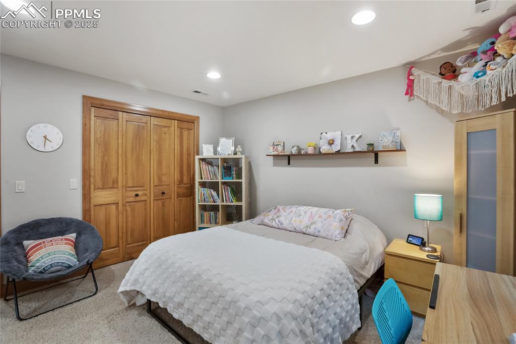 Image 40 of 49: Basement level bedroom with walk in closet and Jack and Jill bathroom