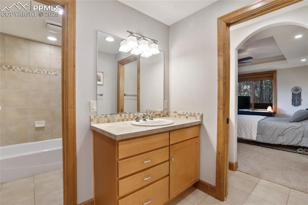 Image 41 of 49: Jack and Jill bathroom in basement