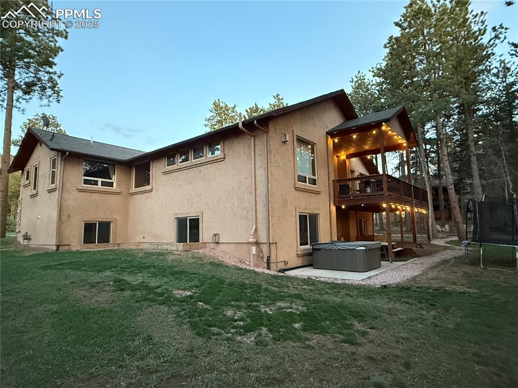 Image 5 of 49: Backyard with hot tub