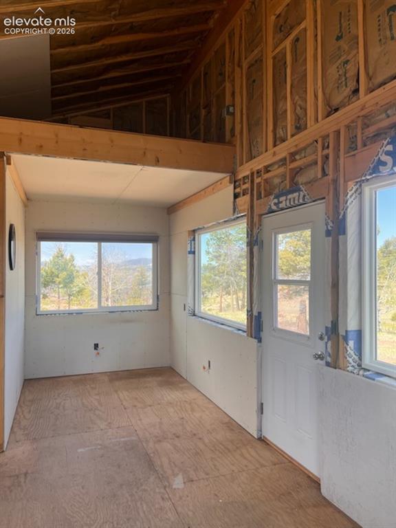 Image 23 of 50: Dining or Bedroom Area. Note the Loft above for either storage or strongly