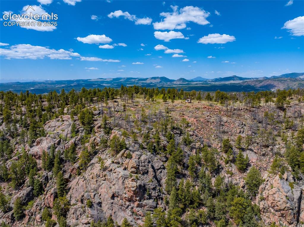 Image 8 of 50: Aerial from the East to the Cabin. Who Loves to Rock Climb on your own pro
