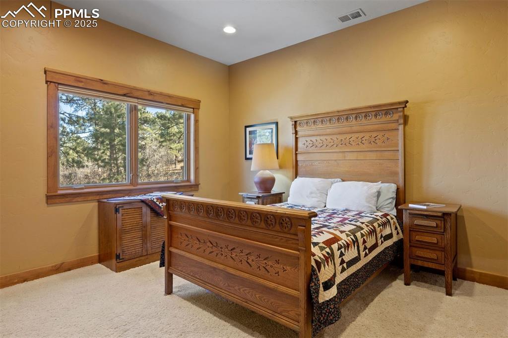 Image 25 of 41: Lower level bedroom also shared the Jack-and-Jill ensuite. 