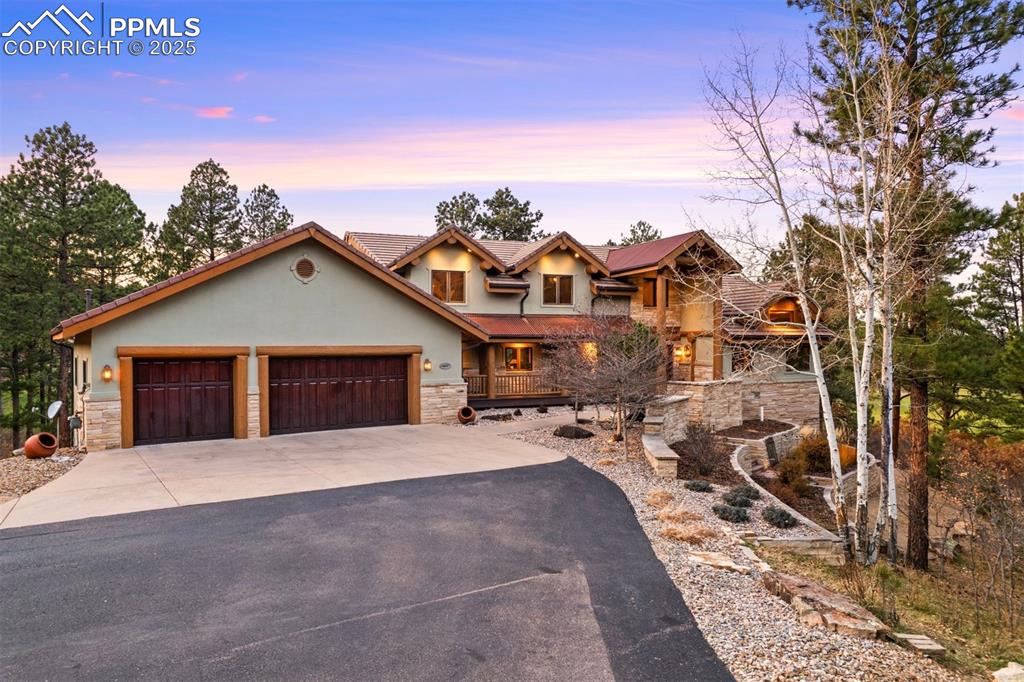 Image 3 of 41: Outside the home presents the look of an iconic Colorado lodge, with outdoo