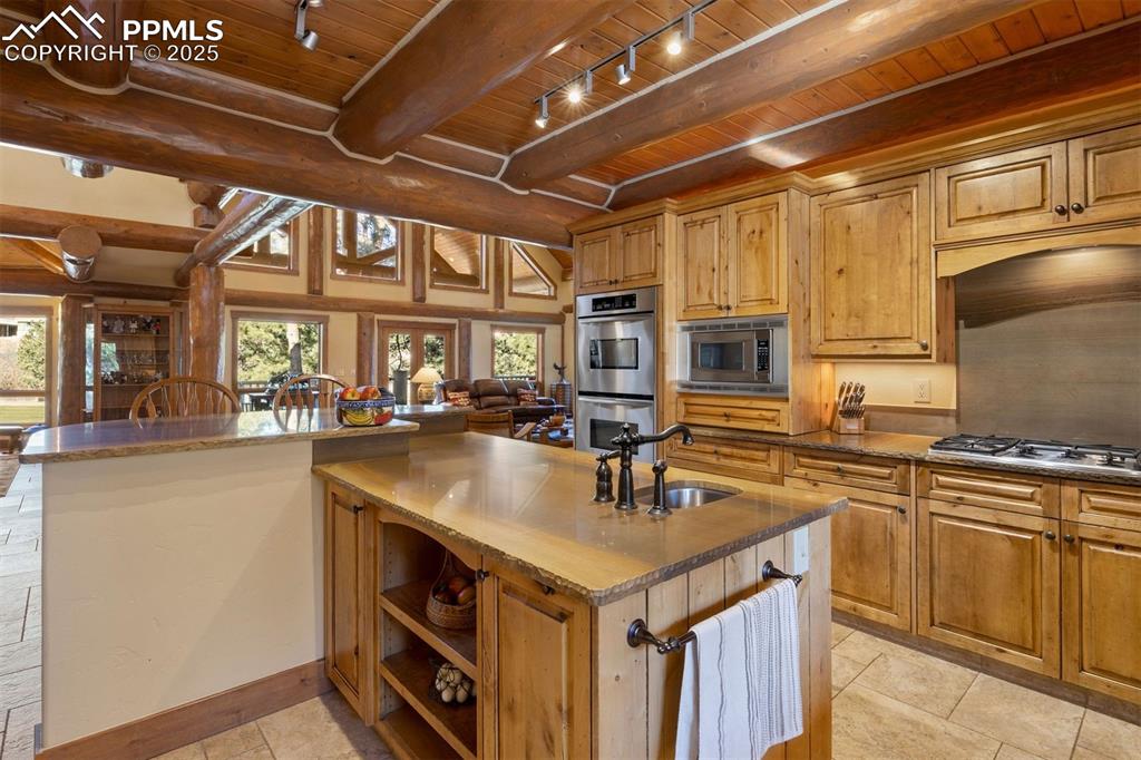 Image 9 of 41: Seamless connection to the kitchen, great room, and dining area for effortl