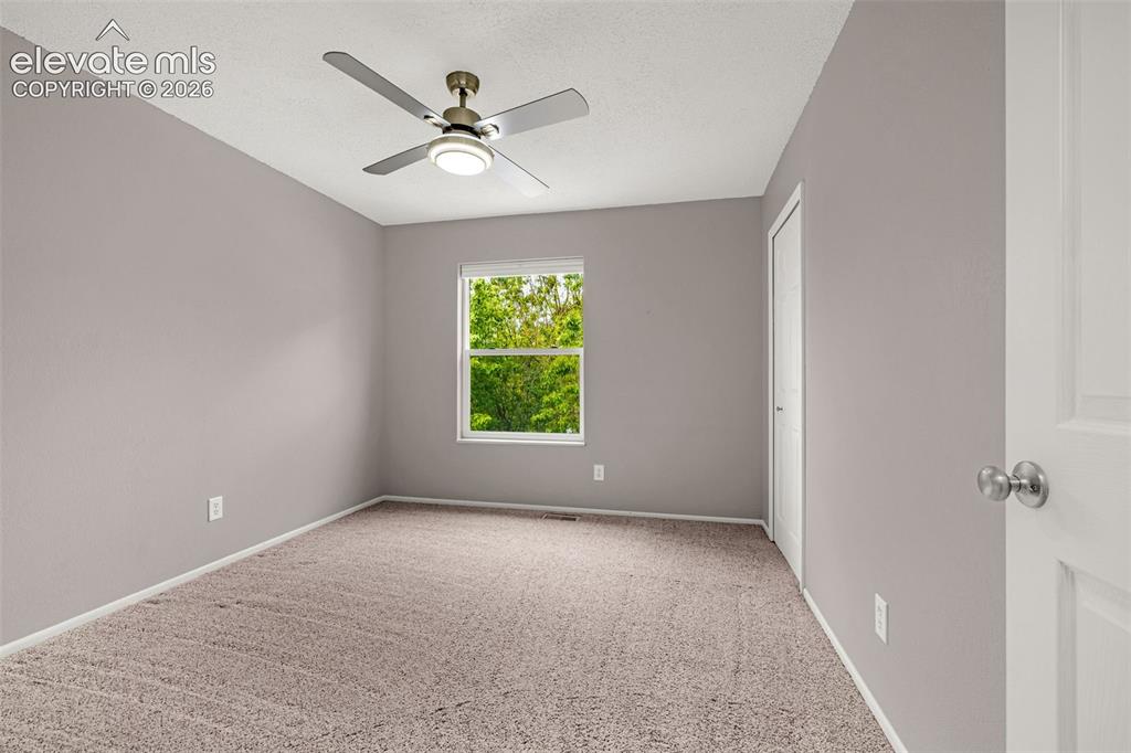 Image 14 of 44: Bathroom featuring a white vanity with built-in storage, a wall-mounted med