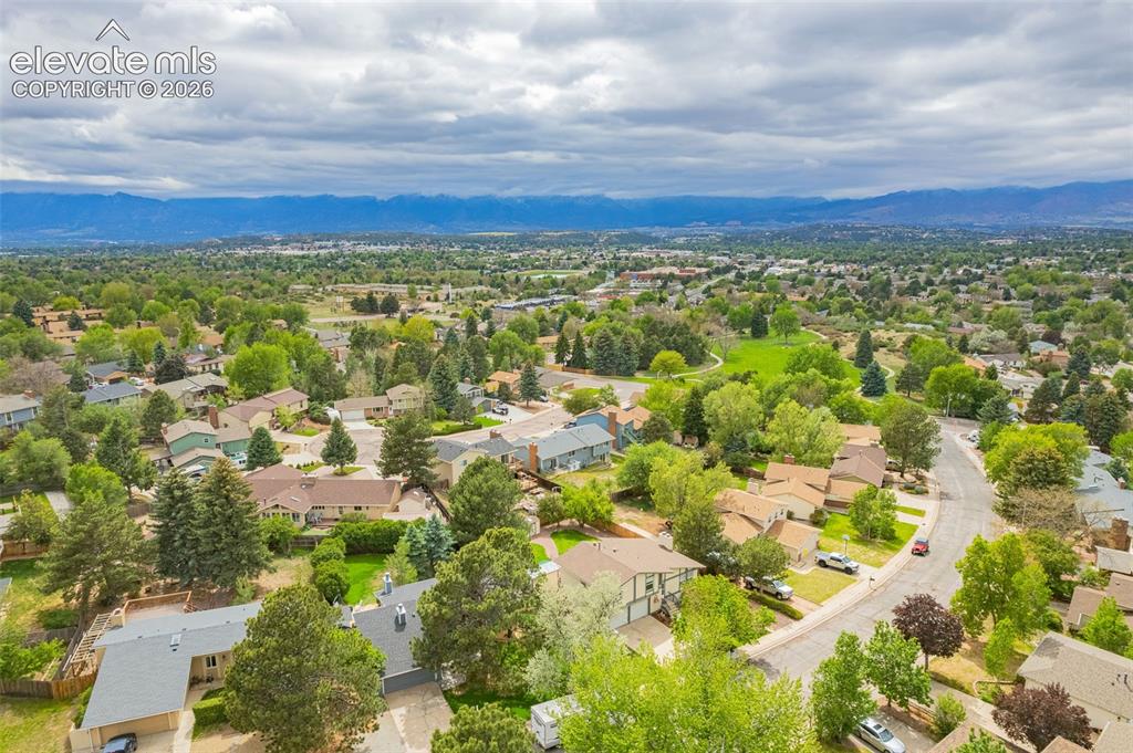 Image 38 of 44: Aerial perspective of a residential neighborhood featuring established home