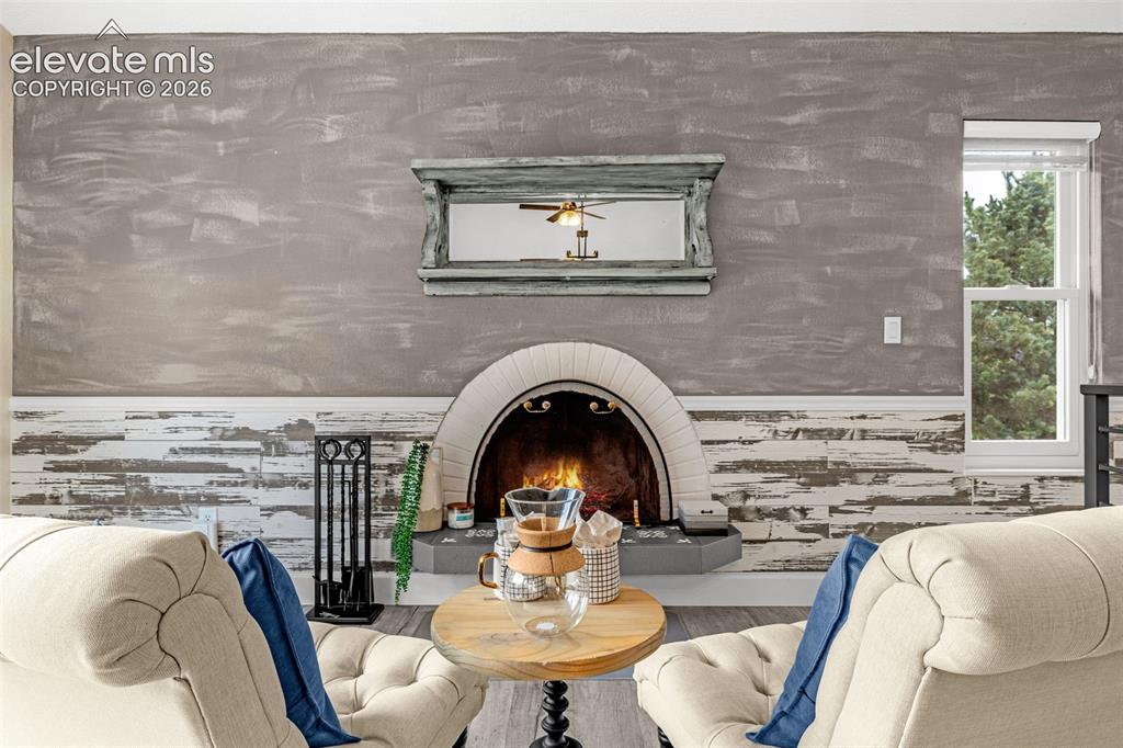 Image 6 of 44: Contemporary kitchen featuring white cabinetry, stainless steel appliances,