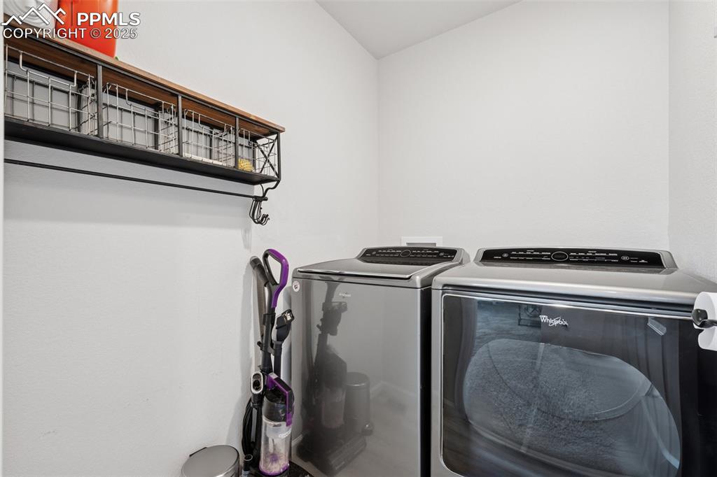 Image 19 of 30: Laundry area featuring separate washer and dryer