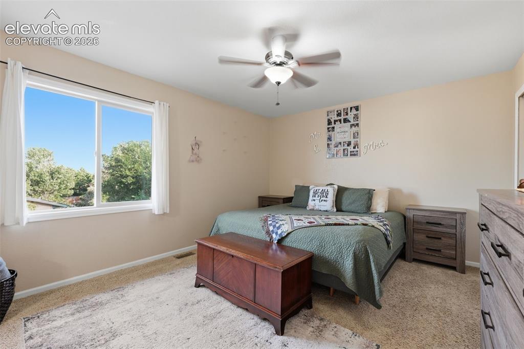 Image 15 of 28: Spacious room featuring a white-framed window, neutral painted walls, textu