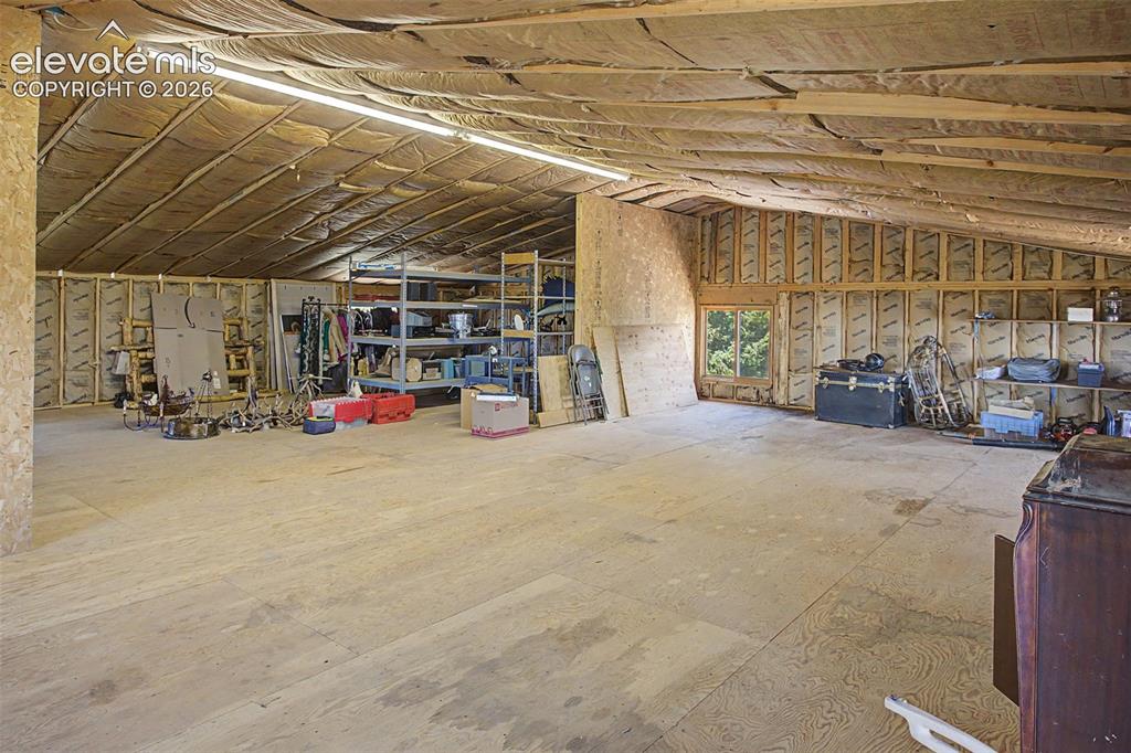 Image 27 of 30: Unfinished 2nd floor above garage