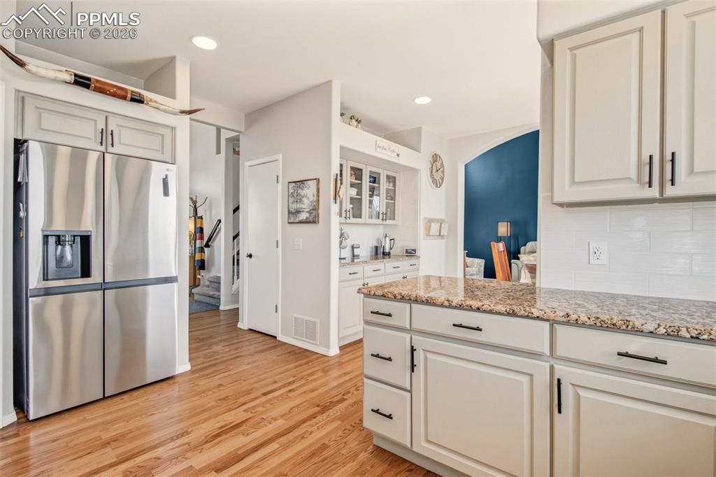 Image 11 of 45: Kitchen with stainless appliances, granite counter tops, walk in pantry and