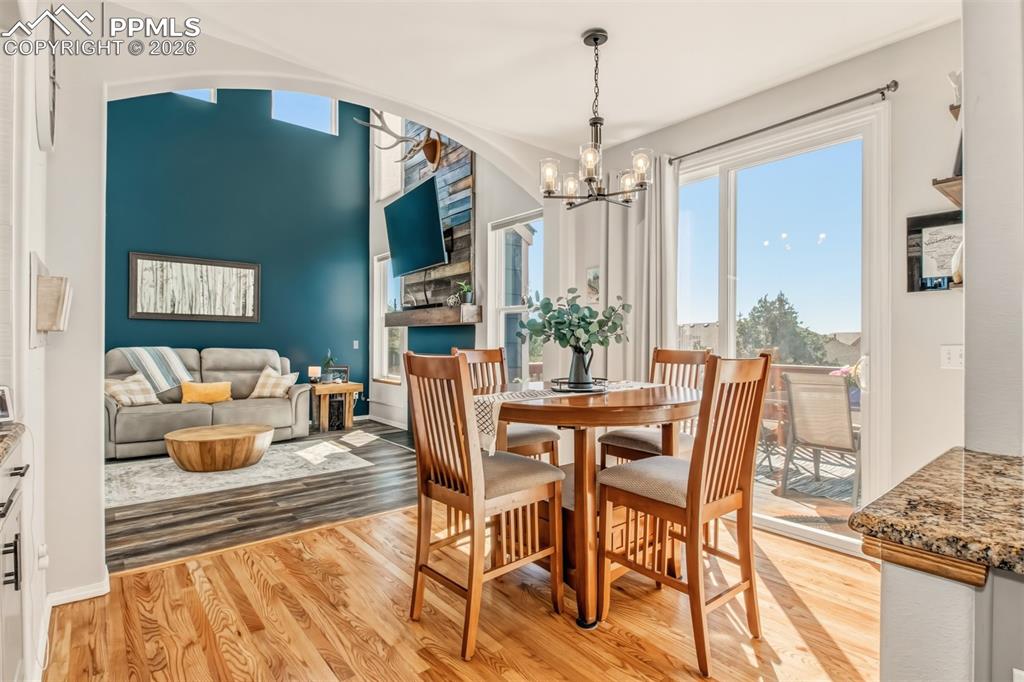 Image 12 of 45: Dining room with a walk out to the back deck