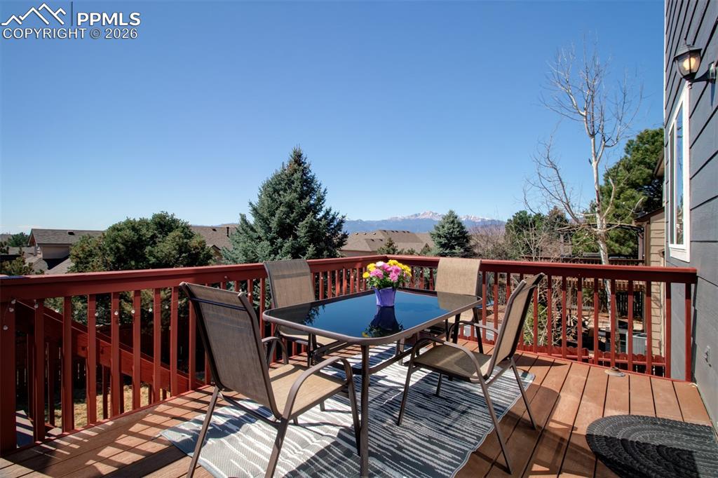 Image 13 of 45: Walk out deck with views of Pikes Peak and surrounding mountains