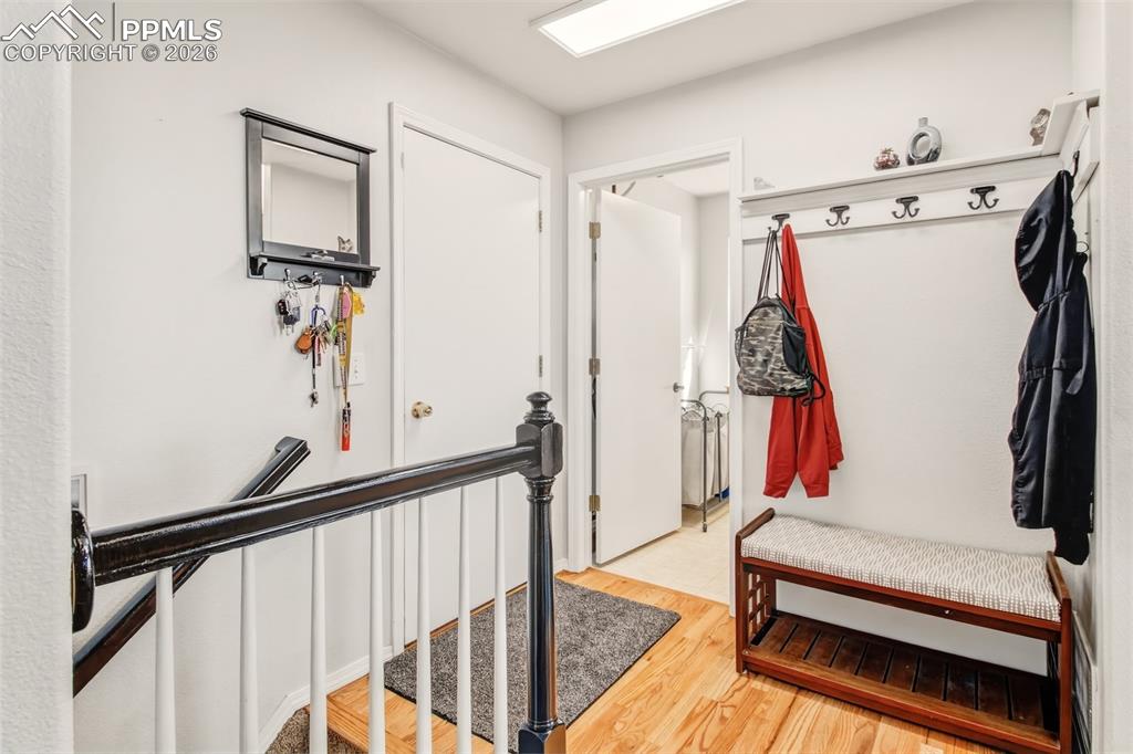 Image 19 of 45: Main landing with garage, laundry and basement access.