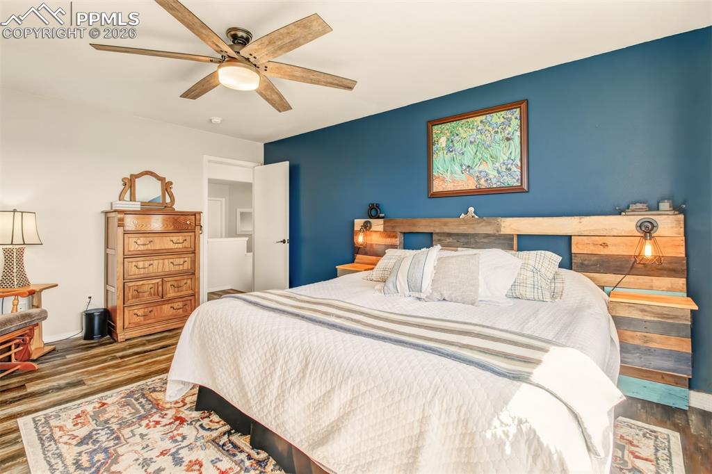 Image 22 of 45: Primary bedroom with views of the mountains out of the windows, an en suite