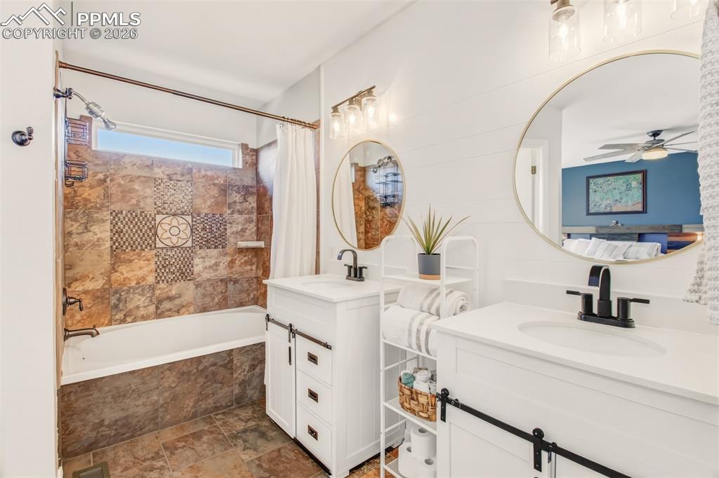 Image 23 of 45: 4 piece primary bathroom including dual sinks and a walk in closet